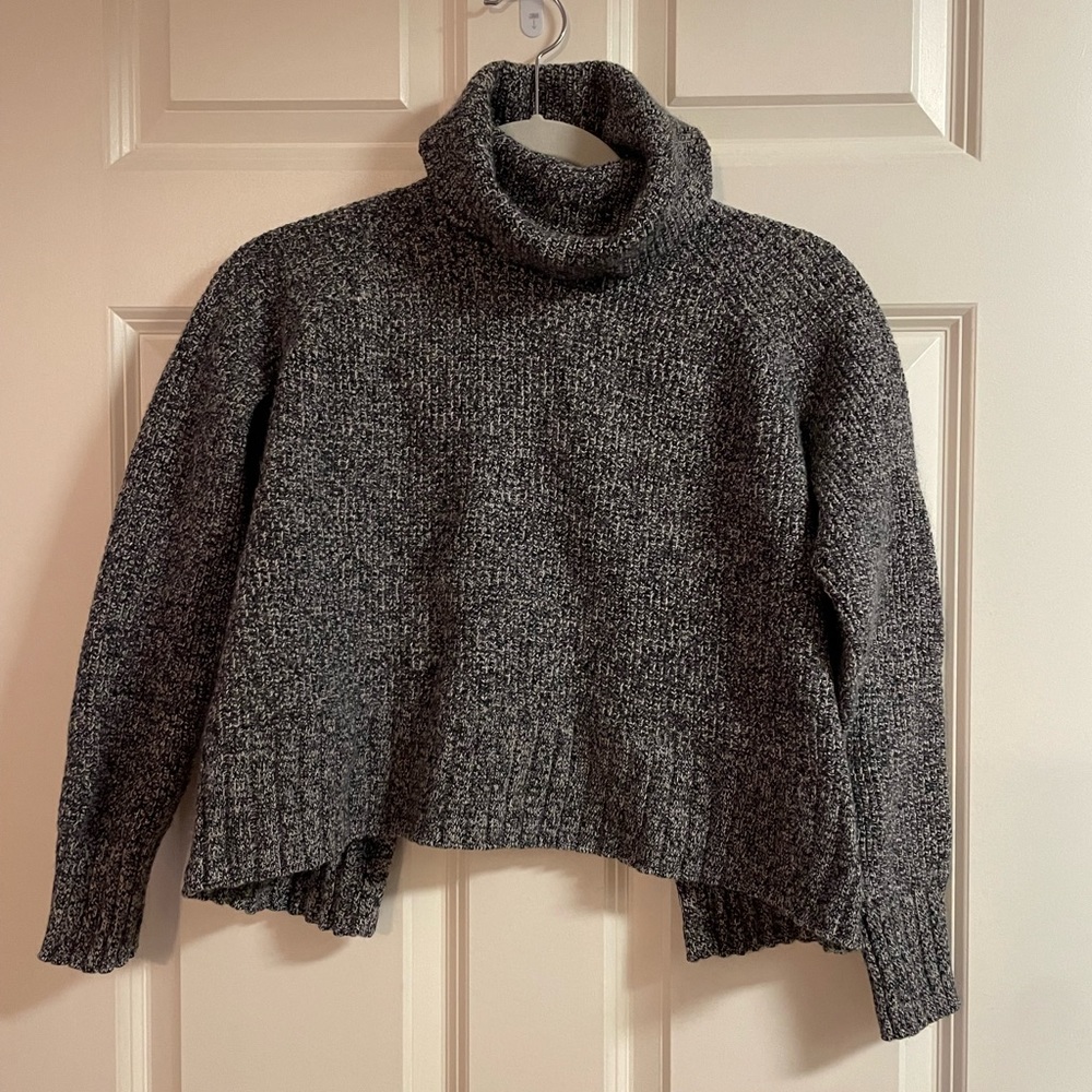 Gray, asymmetrical turtleneck sweater from Madewell.